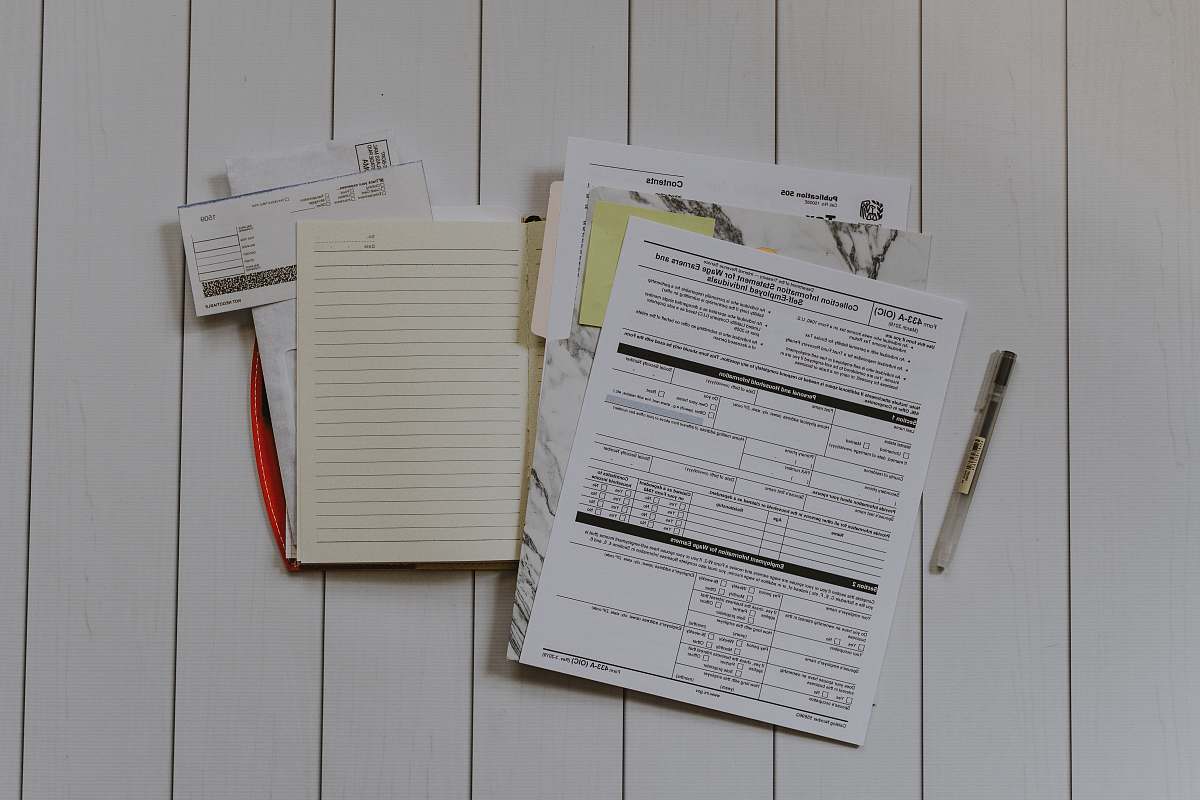 file binder stack of papers flat lay photography accounting